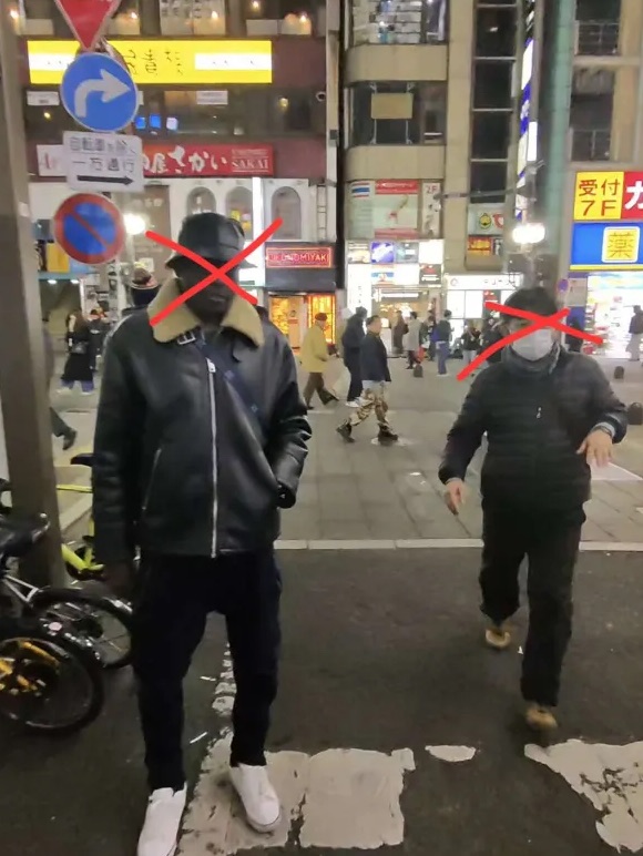Touts working a Kabukicho street corner at night